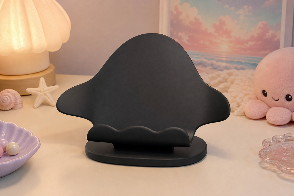 Black manta ray phone stand on a pastel desk, coastal cute room decor preview