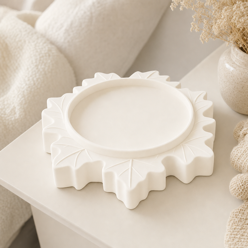 Maple Leaf Display Riser in White, a pastel display riser that lifts a small object on a shelf or vanity